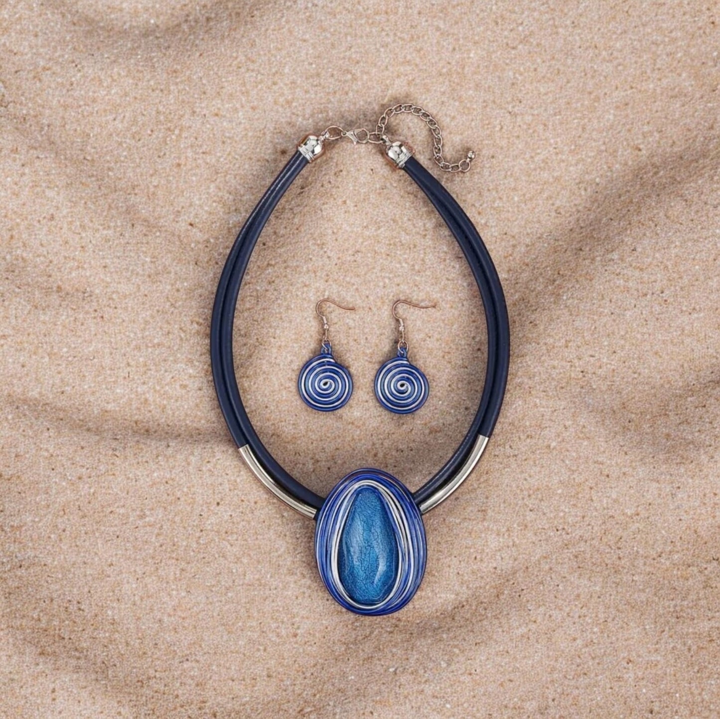 This stylish 2-piece set showcases artisanal craftsmanship with a striking blue resin stone centerpiece. Each stone is elegantly embossed with rope detailing, adding texture and sophistication to the design.