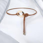 Knot design belt with gold buckle