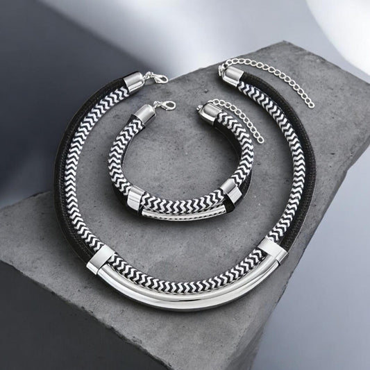 The 2‑piece Bohemian Beach necklace &amp; bracelet set in Black, White &amp; Gold captures the carefree spirit of seaside style with a touch of elegance. 