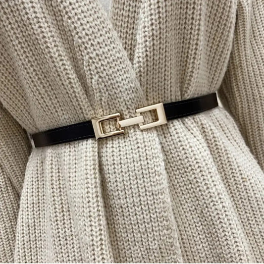 Black belt with gold decorative buckle