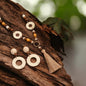  Y‑shaped necklace, crafted with resin, wood beads and textured raffia accents