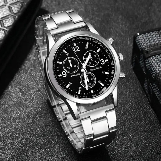 Timeless sophistication defines this classic gent’s watch, crafted with a sleek silver stainless steel band for durability and style. The design features a choice of either a bold black dial face or a crisp white dial face, allowing you to match your personal aesthetic. With a band length of 15cm, band width of 2cm, and a dial diameter of 4.2cm, it offers a balanced fit that’s both comfortable and striking. Powered by reliable quartz movement, this watch is the perfect accessory to elevate everyday wear or 