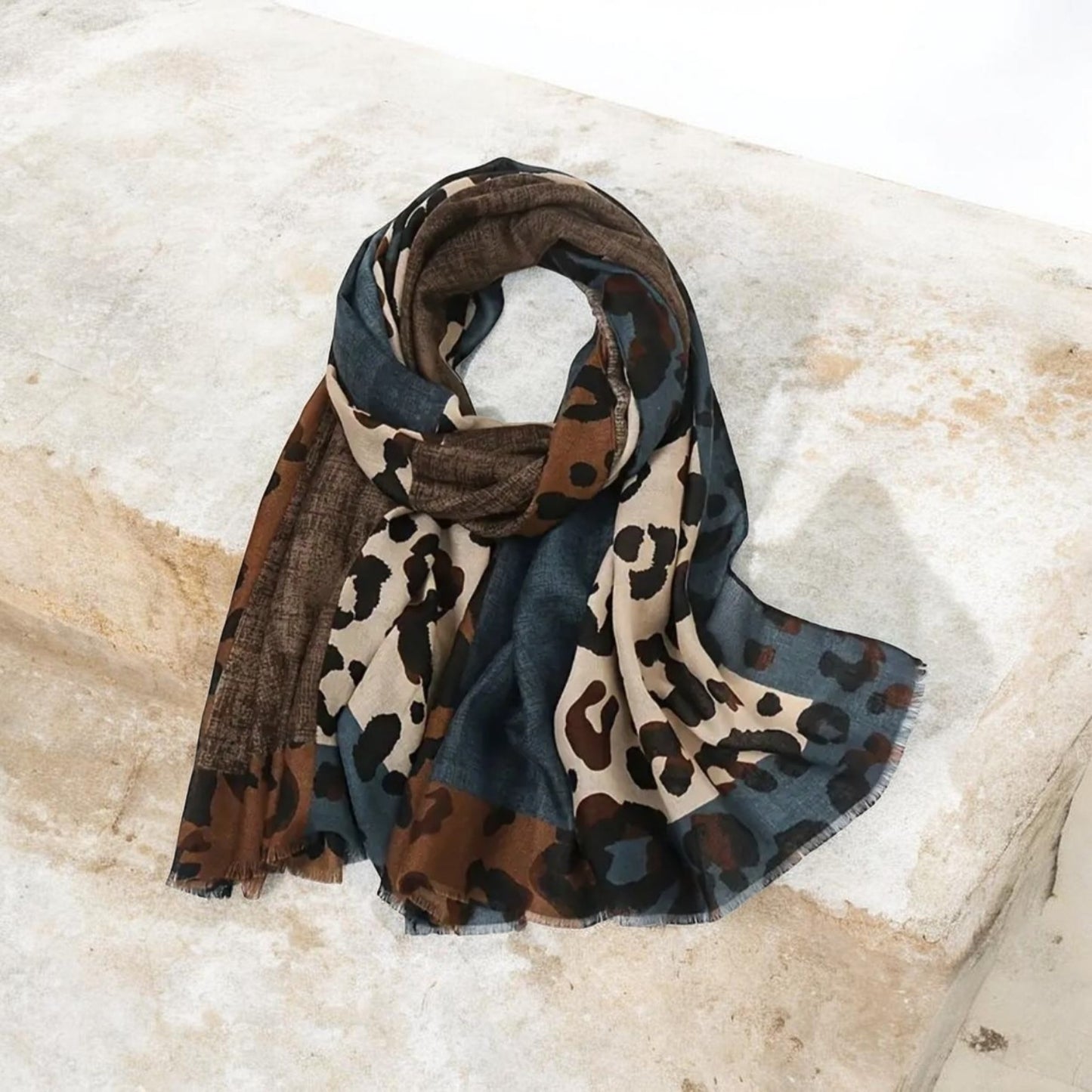 Leopard print scarf with beige brown and blue tones