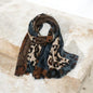 Leopard print scarf with beige brown and blue tones