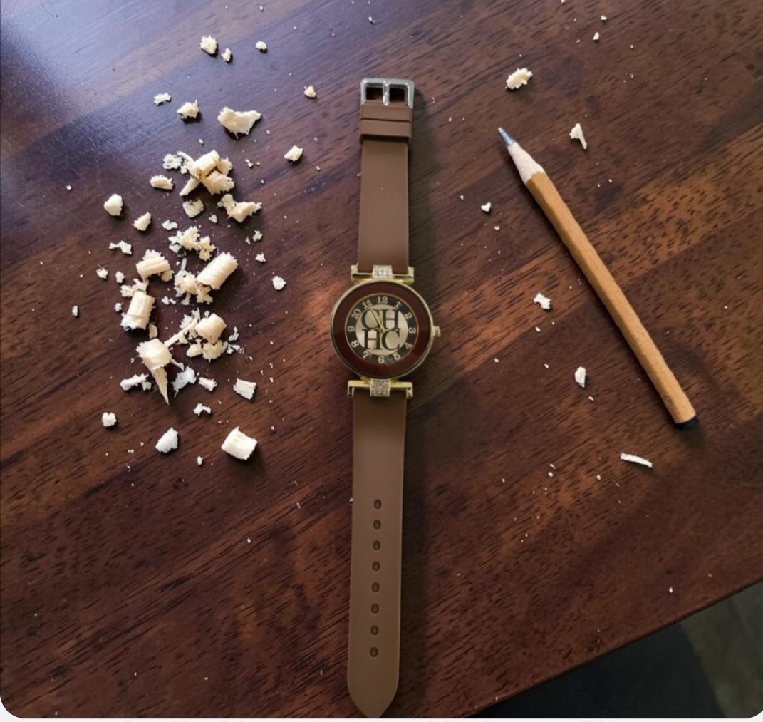Add a touch of elegance to your everyday look with this ladies’ casual watch. Featuring a radiant gold face and a comfortable rubberized band, it’s available in brown to suit your style. The band is accented with a subtle touch of diamante, giving it just the right amount of sparkle. Perfect for casual wear yet chic enough to elevate any outfit, this watch blends practicality with feminine charm.