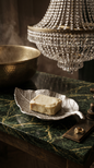 This beautifully crafted multipurpose leaf-shaped dish is available in silver. Made from Resin. Measuring 23 x13 cm