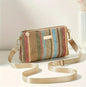 Multicolor woven handbag with silk like strap in green undertones